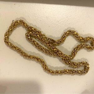 Gold tone braided necklace